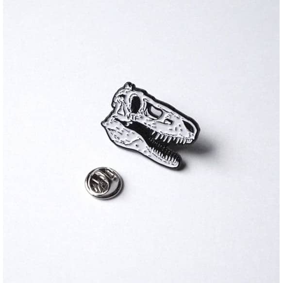 Pin a forma di teschio di dinosauro in metallo con chiusura a farfalla
