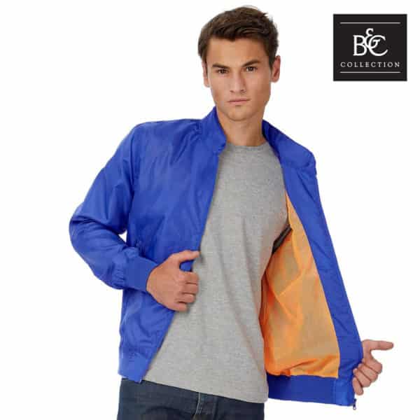 Uomo con giacca blu interno arancione traspirante con cappuccio e tasche con zip 100% poliestere
