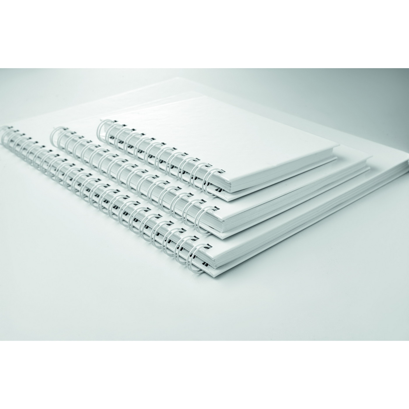 Tre bloc notes con carta lucida