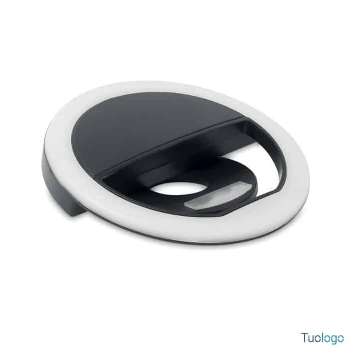 Luce led bianca e nera per smartphone appoggiata su piano bianco