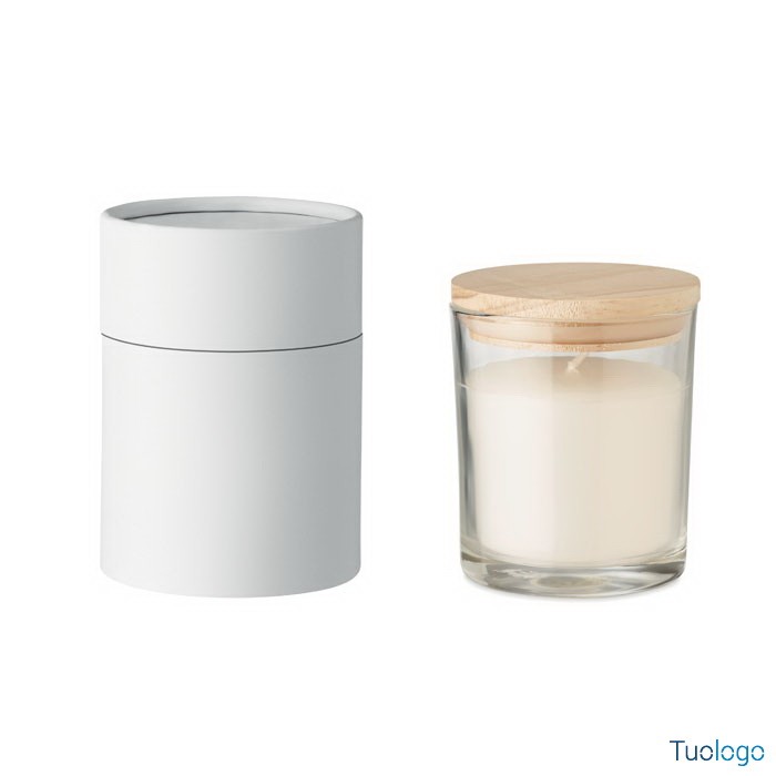 Candela profumata dentro vasetto di vetro con tappo in bamboo chiuso e confezione a tubo di carta