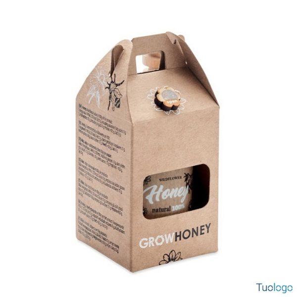 Vasetto dentro confezione di carta con logo grow honey, su sfondo bianco