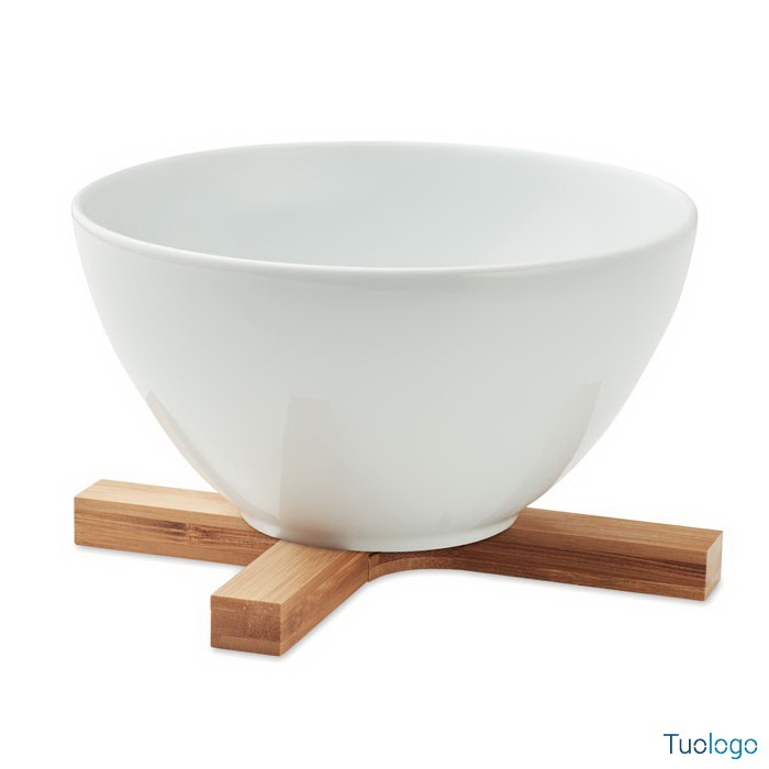 Sottopentola a forma di croce in bamboo con appoggiata tazza