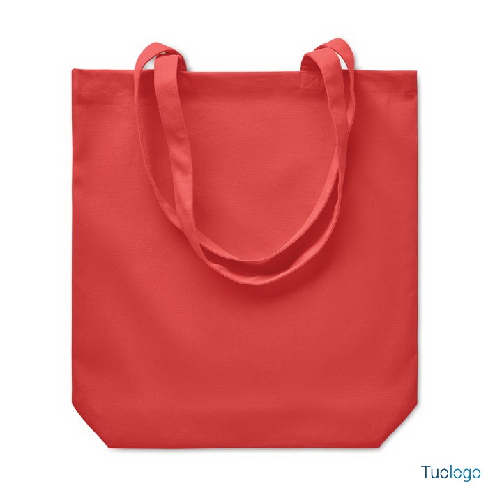 Shopper rossa con manici lunghi, su sfondo bianco