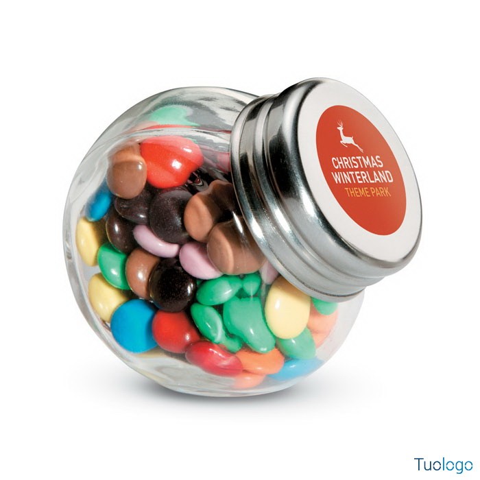 Barattolo in vetro con tappo metallico rosso contenente caramelle