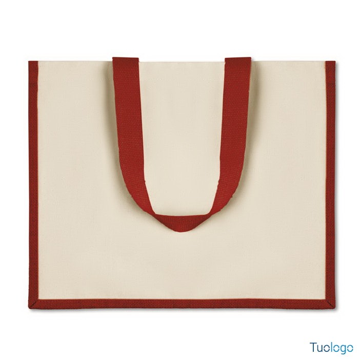 Shopper bianca con rifiniture e maniglia rossa su sfondo bianco